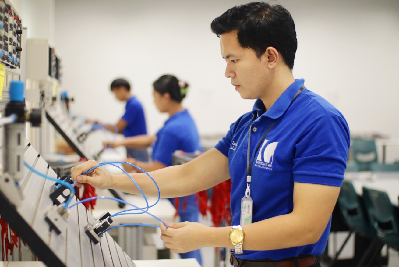 Student working on technical engineering equipment